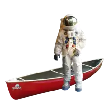 Astronaut standing by his canoe