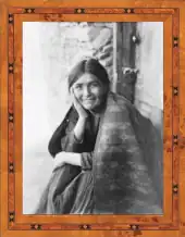 Framed photo of a young Indian, sitting and smiling