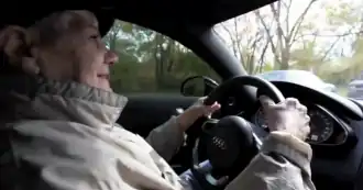 Old woman in a car