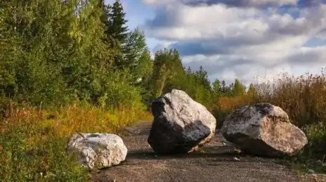 Three rocks in the driveway