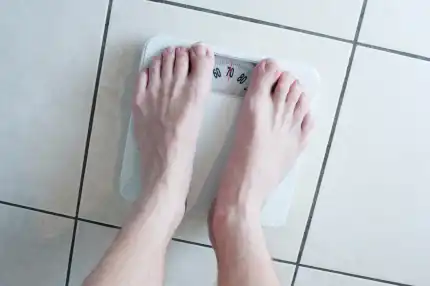 Man standing on a bathroom scale